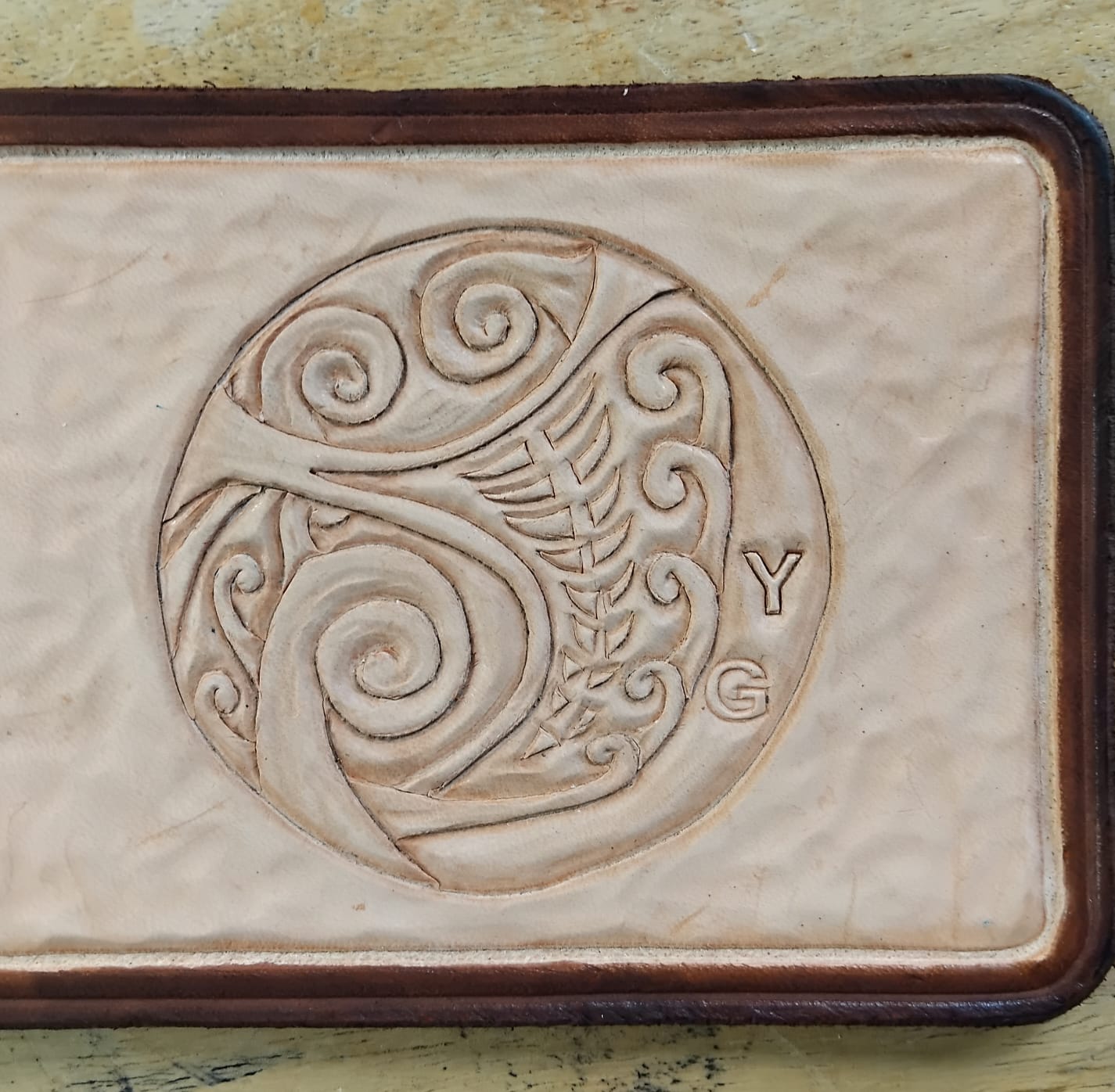 Maori inspired carved leather panel