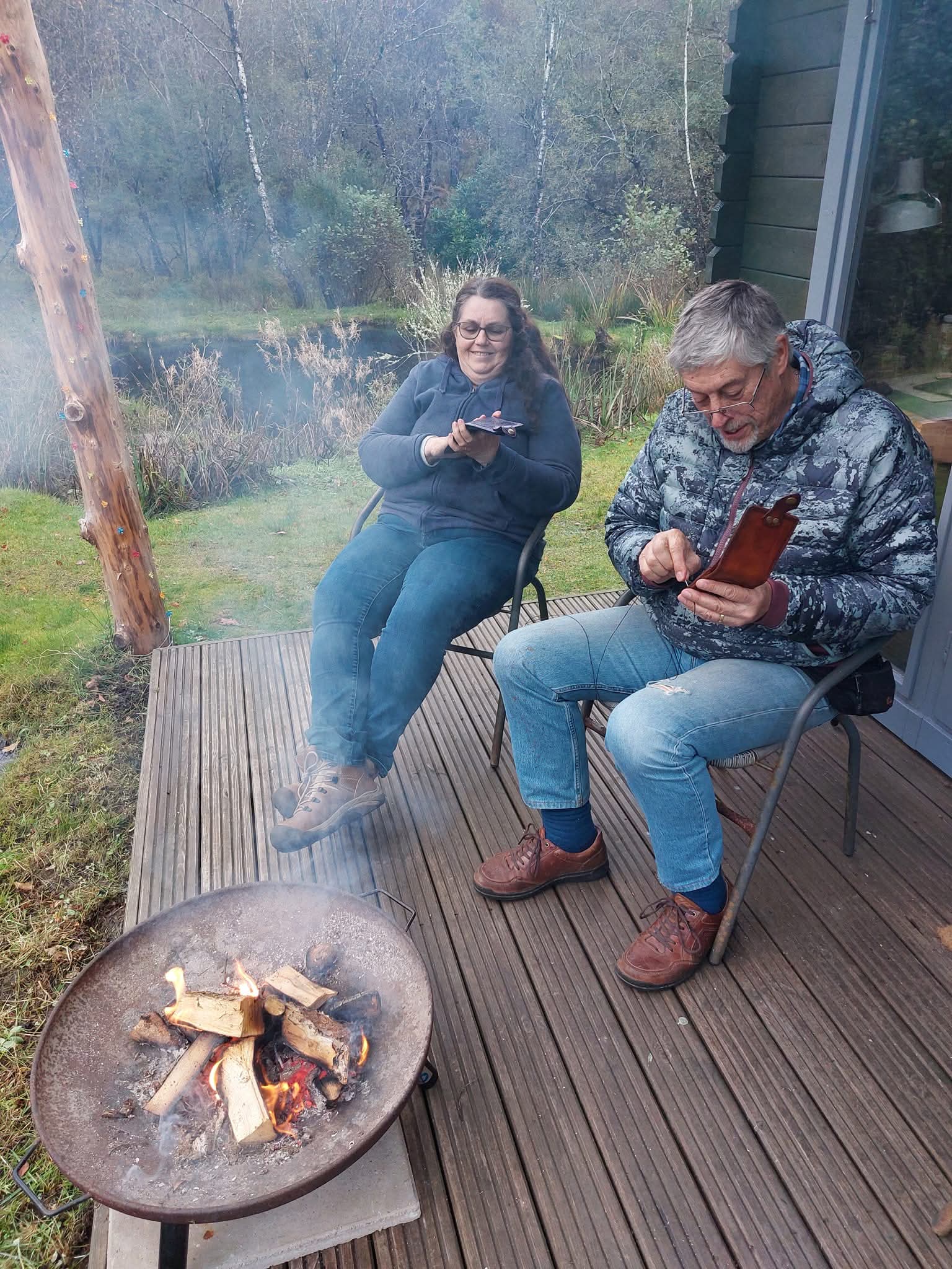 Students stitching by the fire